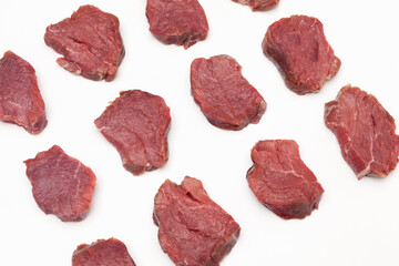 Juicy pieces of meat, top view. Beef tenderloin (steaks). Close-up, selective focus, copy space