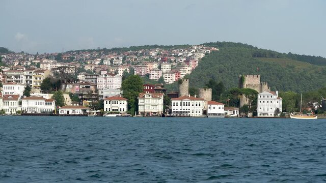 Beuatiful buildings (aka yali) and Anadolu Hisari (Castle) at the bank of Bosphorus, Istanbul, Turkey
