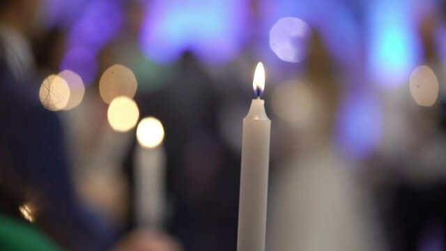 People light candles at a party, event, wedding, or Church