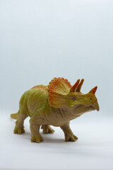 Obraz premium dinosaur toy isolated on white