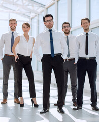 group of young employees standing in the office