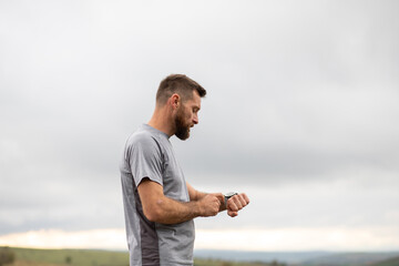 runner checking his smart watch