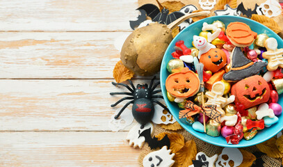 candy bowl of chocolates and sweets, Halloween Jack o Lantern cookies - Trick or Treat Halloween card background 