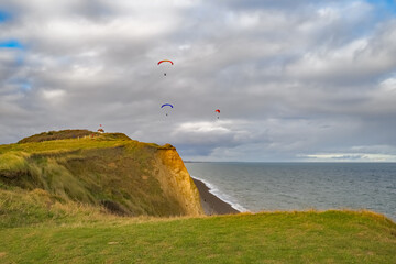 Paragliding over Sheringham cliffs on the North Norfolk Coast