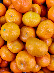 Fresh natural fruits tangerines on the counter of the store