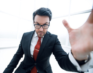 close up.serious businessman in the workplace