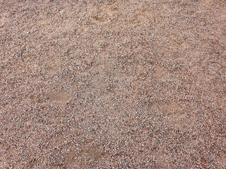 Various small red pebble stones texture background.