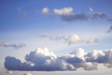 fluffy clouds on the blue sky