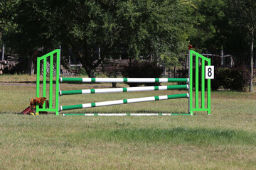  Obstacles poles  barriers for jumping horses as a background