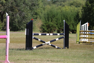  Obstacles poles  barriers for jumping horses as a background