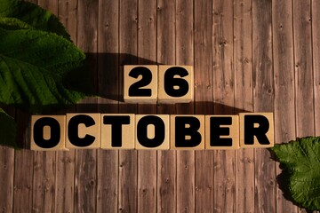 October 26.October 26 on wooden cubes on a wooden background.Autumn.Calendar for October.