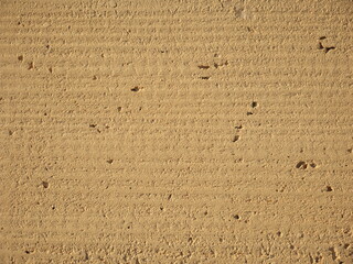 Texture of rough wall in white stone of a building