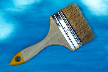 Wide brush for painting on blue isolate