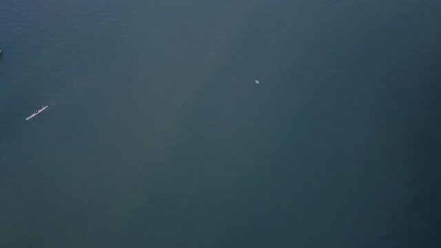 Top down view of cayak and lonely boat in a blue water of Vancouver
