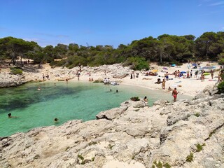 Fototapeta na wymiar Playa Cala Des Talaier famous paradise beach with turquoise water and pine forests on south coast of Menorca Island, Balearic Islands, Spain