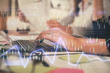 Multi exposure of woman hands typing on computer and financial graph hologram drawing. Stock market analysis concept.