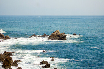 waves crashing on rocks