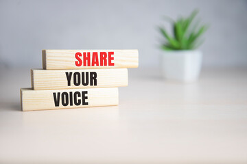 Share Your Voice text on a wooden cubes
