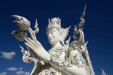 Fototapeta na wymiar Temple and building Thai cultural arts in contemporary style At Wat Rong Khun, Chiang Rai Province, Thailand