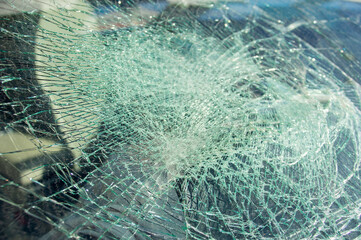 Broken windshield in car by a traffic accident
