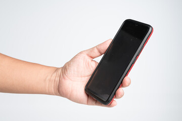 Hand holding old smartphone with dust and dirty screen on white background