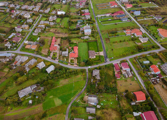 Landscape from a height of a village from a height, top view with fields