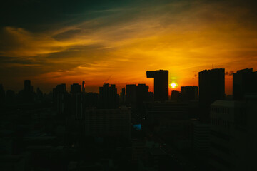 Sunset or evening time with the building tower in Bangkok, Thailand.