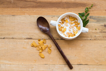mix corn flakes, milk healthy foods for children eats in breakfast decoration flat lay style on background wooden