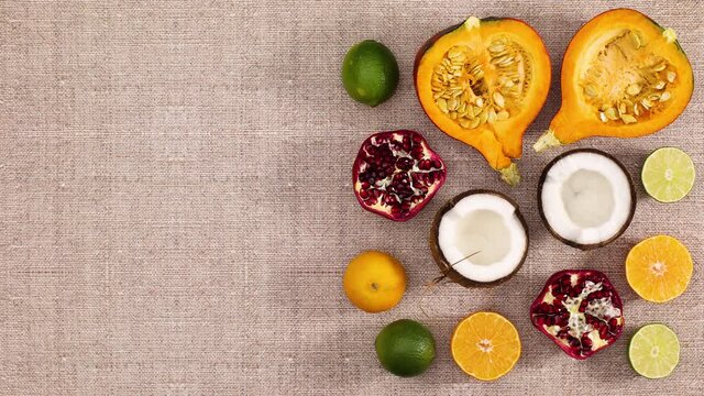Sliced fruits appear on right side of kitchen table. Stop motion 