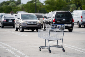 Empty shopping cart in parking lot © Felix Mizioznikov