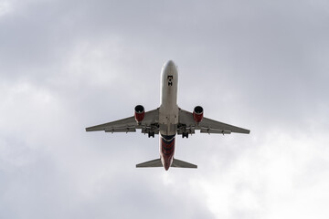 Airplane coming for landing with wheels down