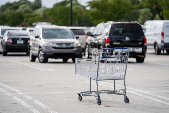 Empty shopping cart in parking lot