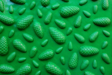 Green acupuncture orthopedic mat. Massage mat for the prevention of flat feet in children and adults. View from above. Orthopedist. Prevention.