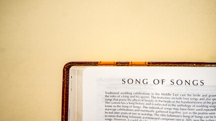 Open pages of the bible background (book of song of songs)
