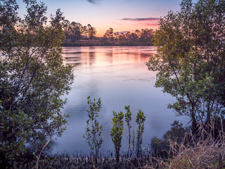Beautiful Riverside Sunset with Reflections
