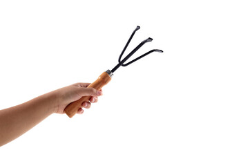 Hand is holding tool rake isolated on white