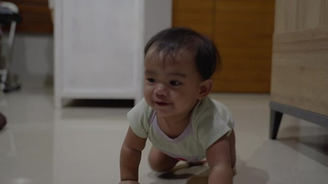 portrait of happy baby crawl at living room