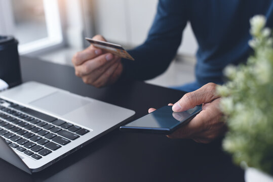 Man Using Credit Card Via Internet Banking Apps On Mobile Phone For Online Shopping And Digital Payment Concept