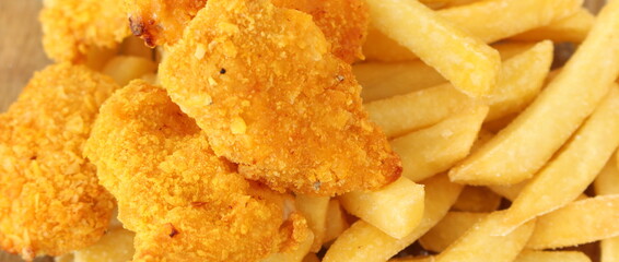 lots of fresh crispy chicken nuggets with french fries