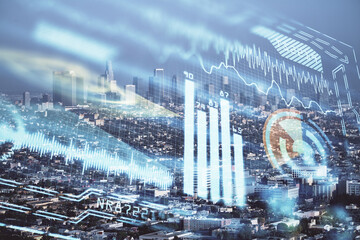 Double exposure of technology theme hologram and cityscape background. Concept of Hightech.