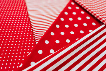 Fototapeta premium Background from a natural fabric in a red and white colors. Lay flat