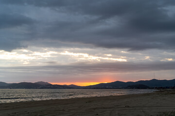 Fototapeta na wymiar Seascape with beach and sunset views.
