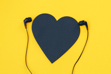 Black heart listning to music on background