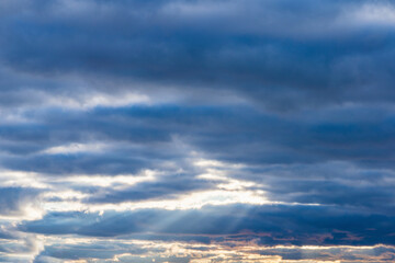 blue sky background with white clouds sun rays autumn day