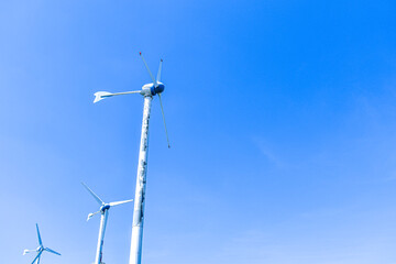 Windmill on the green meadow