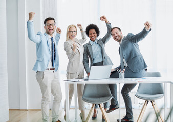 young business people meeting office teamwork celebrating success corporate portrait posing...