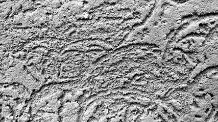 Stucco wall with rough plaster and semicircular furrows, abstract texture background. the texture of the concrete surface with rough stripes semicircle of gray color