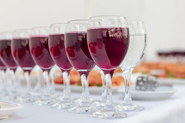 canapes and glasses with a red drink at the buffet