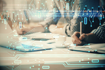 Businessman with computer background with technology theme hologram. Concept of hightech. Multi...