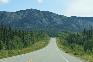 Road tripping through the beautiful landscapes of the Alaskan Highway in the Yukon territory of Northern Canada